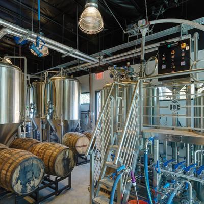 Brewing area, metal pipes and barrels