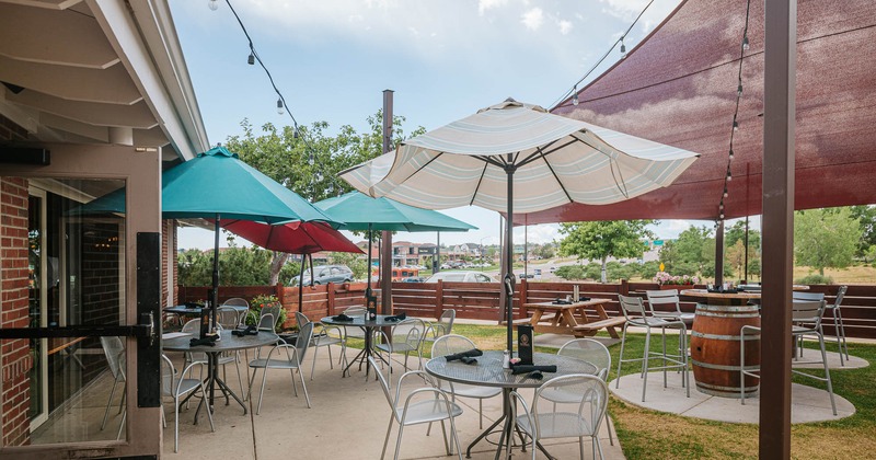 Exterior, patio area, tables with chairs and parasols