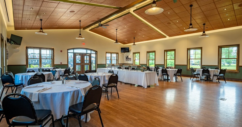 Interior, dining area with rounded tables and chairs