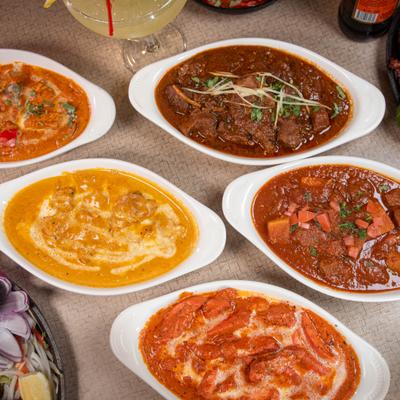 Assorted curry dishes served on the table.