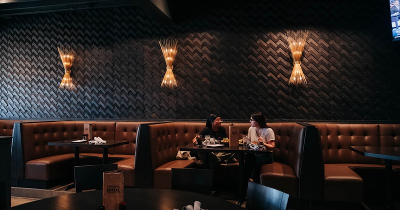 Interior, tables and buttoned leather seating booths