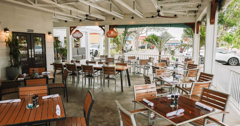 Exterior, covered patio with tables and chairs