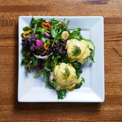 Seattle Benedict, with crab meat, arugula, avocado, dills, and Hollandaise sauce.