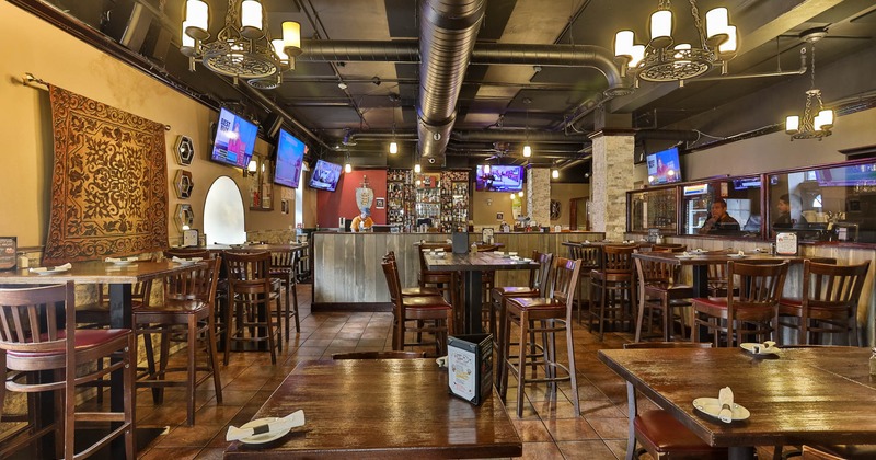 Interior, wide view, wooden tables and chairs