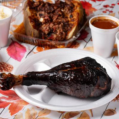Turkey Leg and Signature Loaded Jumbo Stuffed Potato.