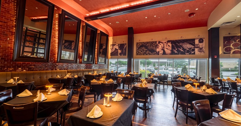 Dining area with set tables and soft lighting