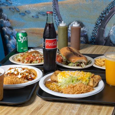 Various food and drinks on the table.