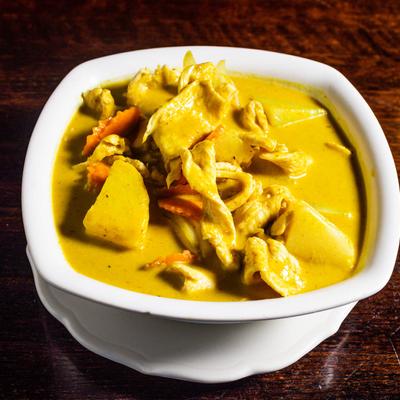 Yellow curry with coconut milk, potato, carrot and onion