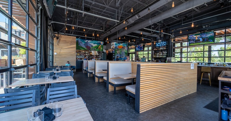 Interior, dining booths and tables with chairs