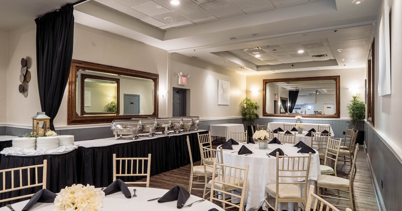 Banquet hall with round tables and buffet setup