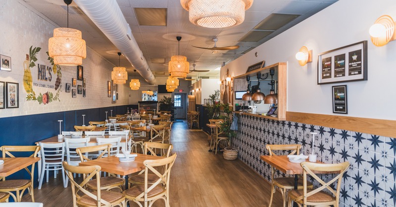 Spacious and cozy dining area with tables ready for guests