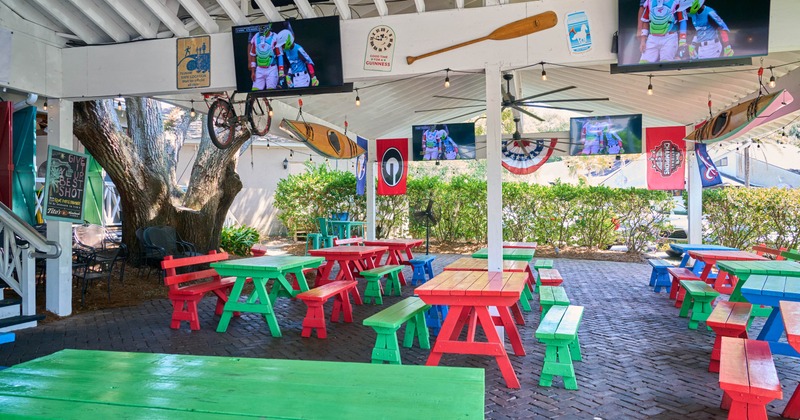 Outdoor patio with colorful picnic tables
