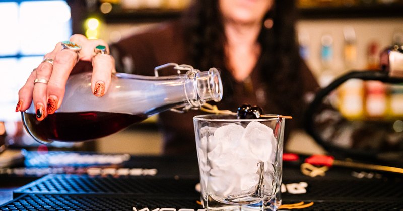 Employee pouring drink