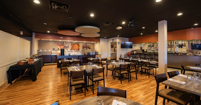 Interior, seating area with ordering counter and a bar in the back