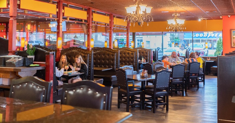 Interior, tables, chairs and leather high back sitting booths