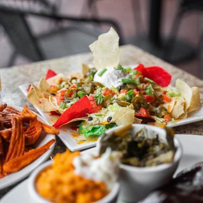Nacho plate with other dishes.