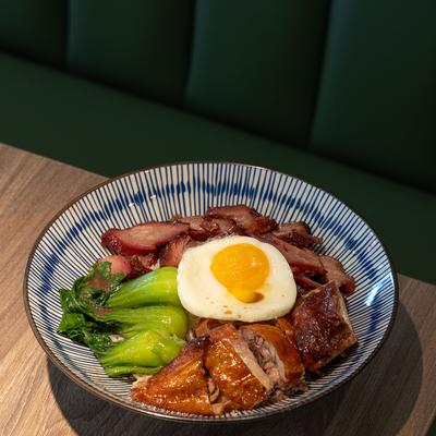 BBQ and Roast Duck with a fried egg and bok choy.