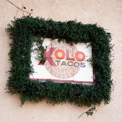Restaurant sign in a wreath.