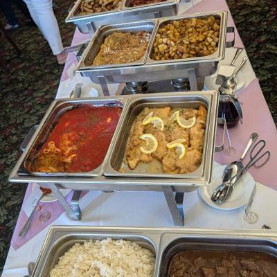 Buffet-style meal with various food items.