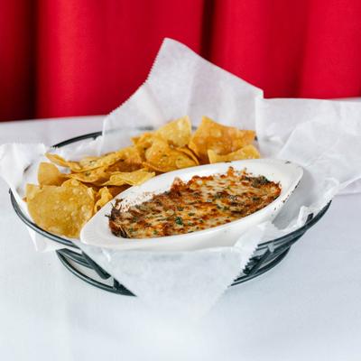 Spinach and artichoke dip with chips.