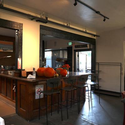 Bar table with decorative pumpkins.