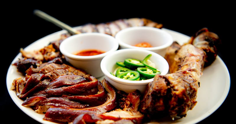 Grilled sliced meat and dips in the middle