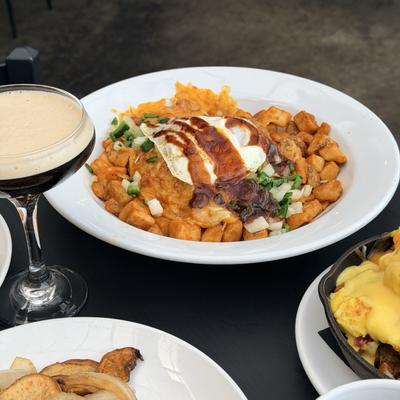 Espresso Martini served alongside various brunch dishes.