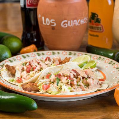Fish tacos, with lettuce, pico de gallo and chipotle sauce