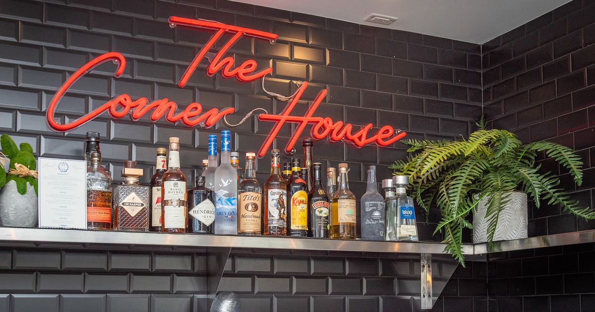 Dirnk rack, drinks, sign on the wall above
