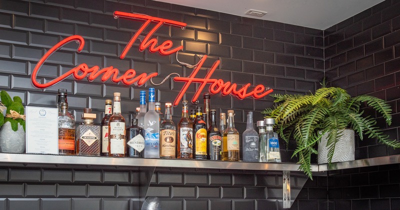 Dirnk rack, drinks, sign on the wall above