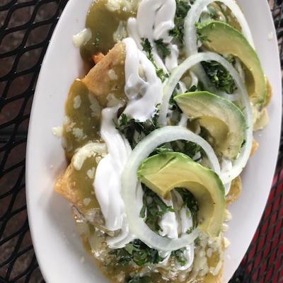 Green  chilaquiles with avocado and sour cream.