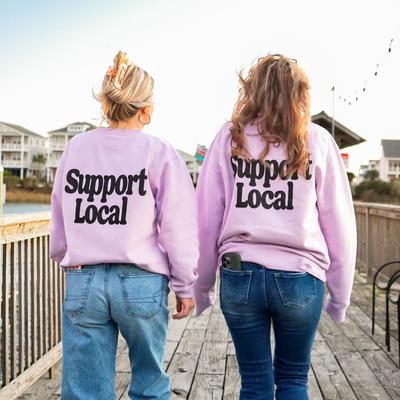 Two people wearing matching lavender 