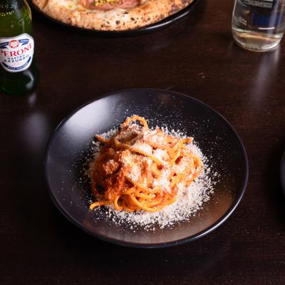Bucatini pasta in tomato sauce.