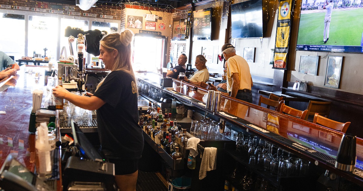 Bartender serving drinks