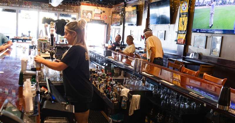 Bartender serving drinks