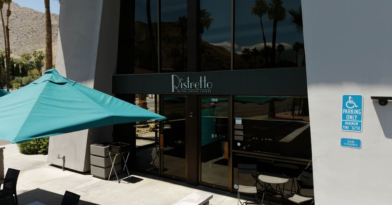 Exterior, storefront with entrance, signage and outdoor seating