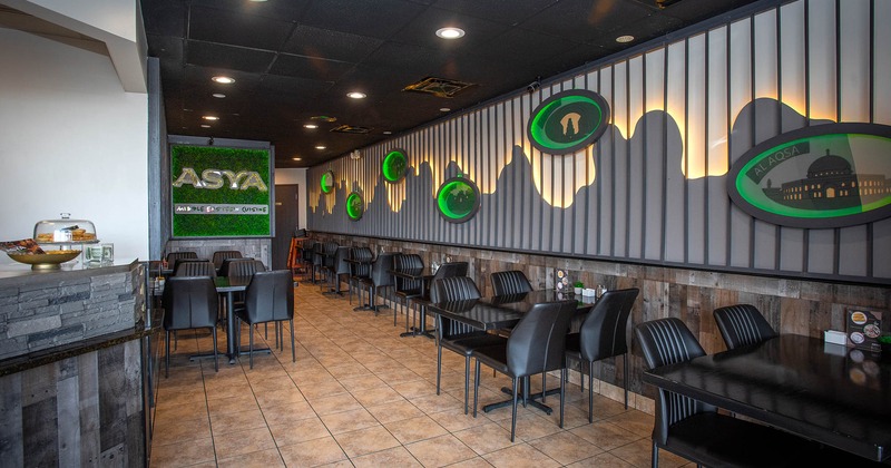 Interior, dining area, tables and chairs for two and four, tile flooring