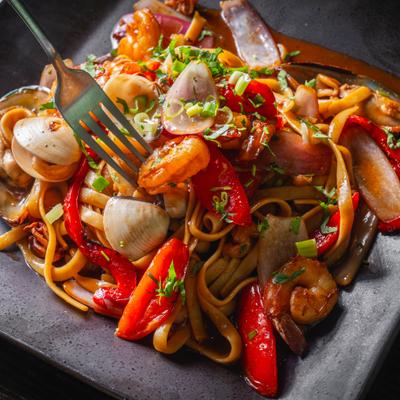Stir fried seafood with noodles and veggies.