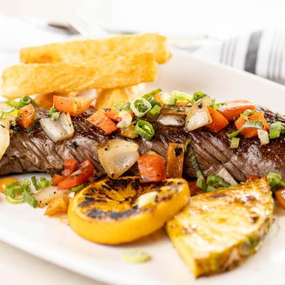 Grilled hanger steak, with potatoes and vegetables.