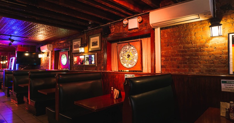 Booths and tables with images on the wall