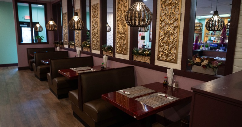 Interior, booths with tableware ready for guests