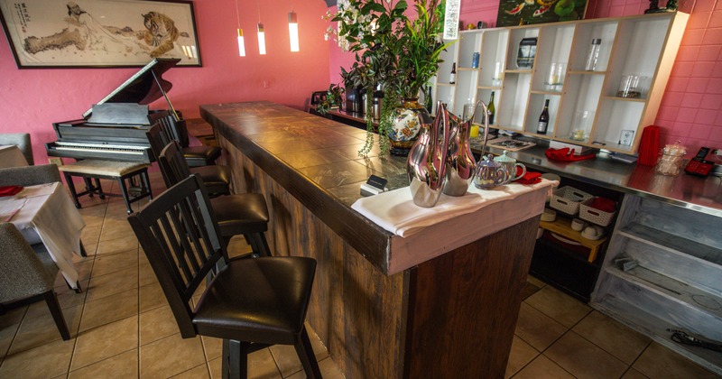 Bar, piano, drink rack, angle view