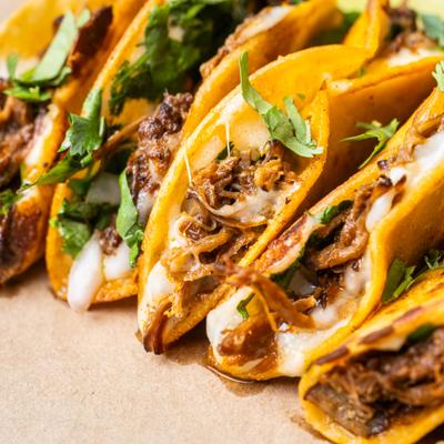 Smoked birria tacos with cilantro, close up.