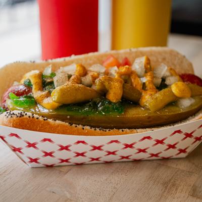 Chicago Dawg with a pickle, mustard, green relish, ketchup and diced onion.