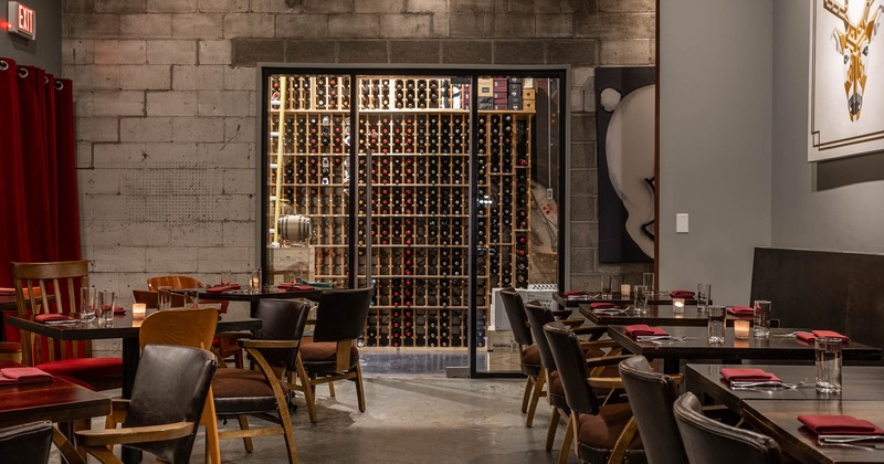Interior, front view of dining area, wine rack in the back