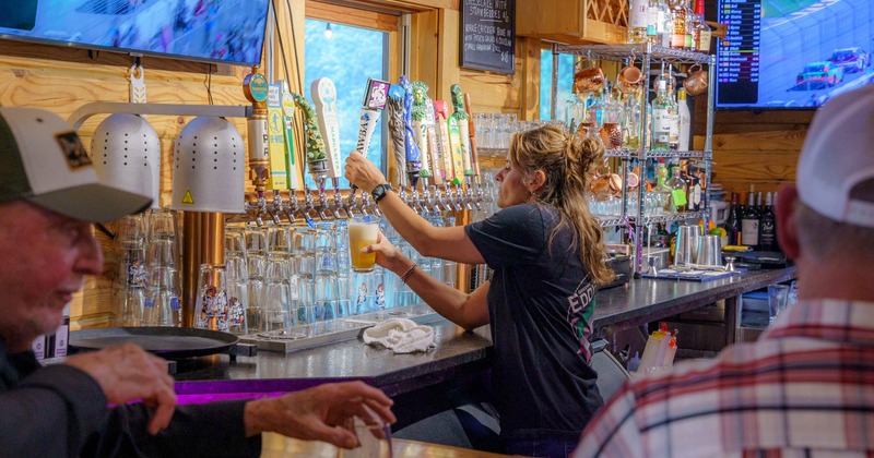 Bartender pouring draft beer