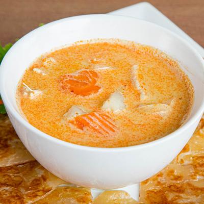 Yellow curry with chicken, potatoes, carrots, and onions.