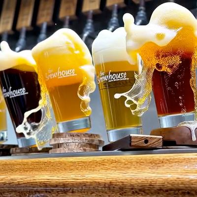 Beers rocking and spilling  at the bar.