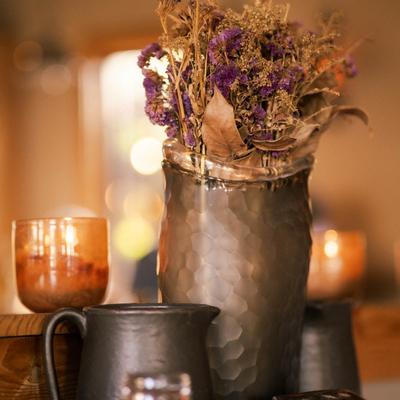 Flowers in a vase and candles.