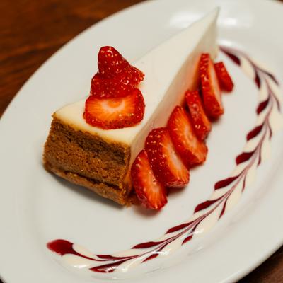 Strawberry Cheesecake garnished with sliced strawberries.
